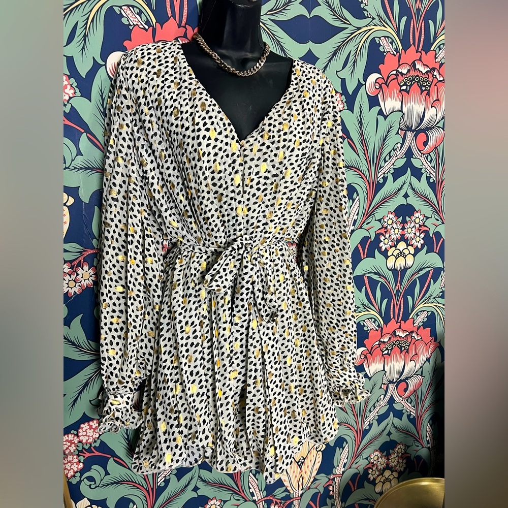White romper with black and gold spots